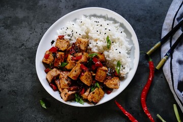  Szechuan tofu stir fry served with jasmin rice, selective focus