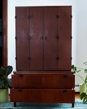 Dark vintage armoire. Tall walnut gentleman's chest. Minimalist furniture. Stop motion moving image clip mp4.