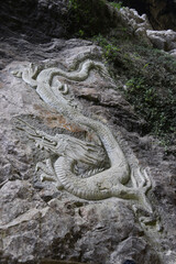dragon sculpture on the wall at three Natural Bridges, Chongqing, China
