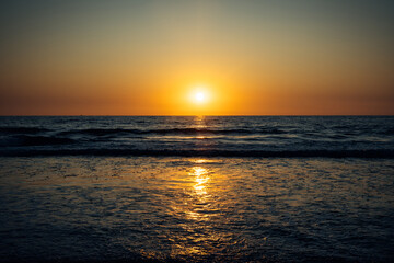 Stunning sunset over the ocean. Colorful evening sky over the sea.