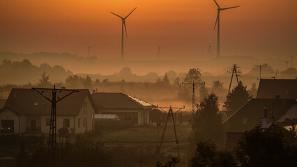 WIND FARM - Wind turbine and countryside in a foggy morning