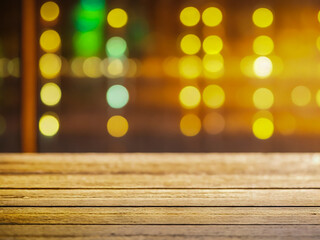 Wooden table over bokeh lights background