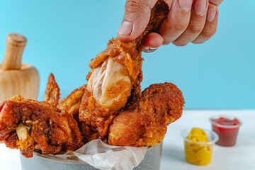 fried chicken taken by hand