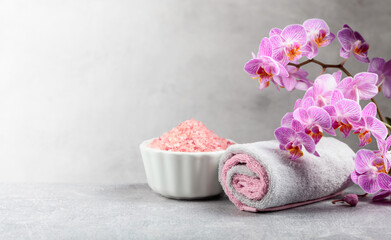 Beautiful blooming orchid flowers and pink sea salt.