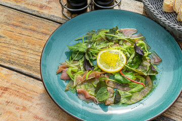 tuna carpaccio with wasabi cucumber salad and herb bouquet