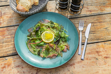 tuna carpaccio with wasabi cucumber salad and herb bouquet