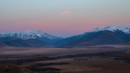 Soft mountains at sunset. Purple sunset over majestic mountains.