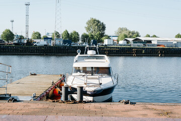 Small boat moored on the pier, front view