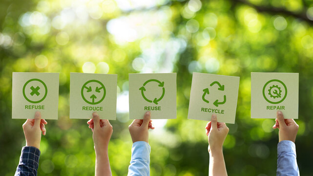 A group of businessmen's hands holding a brown recycled paper card with 5R sign and icon. Recycle, Reuse, Reduce, Refuse, and Repair for zero waste movement and technology ecology care.