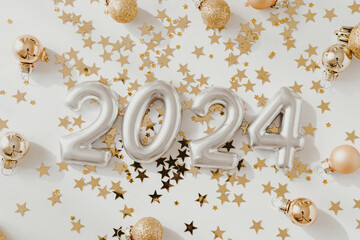 Greeting card - happy new year with numbers 2024 and gold glitter and Christmas balls on white background