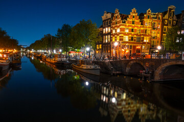 Dutch Houses and Houseboats on the Amsterdam Canal at Night