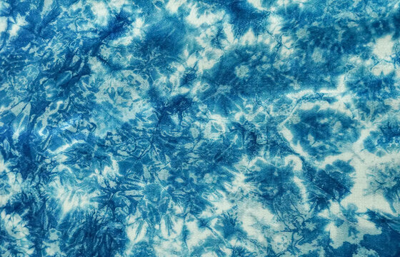 Pattern of blue tie batik dye on cotton cloth, Dyed indigo fabric background and texture.The fabric is indigo dye, Local fabric, marble texture background