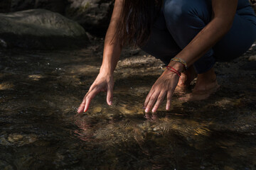 Woman doing yoga in the river