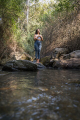 Obraz premium Woman doing yoga in the river