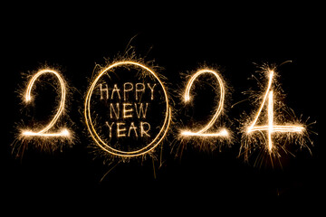 Happy New Year 2024. Sparkling burning text Happy New Year 2024 isolated on black background.