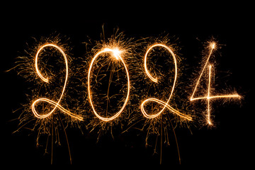 Happy New Year 2024. Sparkling burning text Happy New Year 2024 isolated on black background. - obrazy, fototapety, plakaty