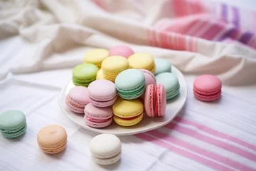 Fotobehang colorful macarons arranged on a white tablecloth © Alfazet Chronicles
