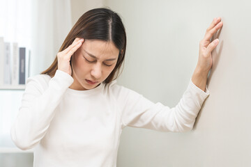 Dizzy asian young woman, girl headache or migraine pain. suffering from vertigo, difficulty...