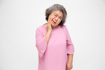 Asian senior woman with toothache isolated on white background, Dental and oral diseases in the...