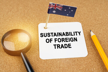 On the table is the flag of Australia and a sheet of paper with the inscription - sustainability of...