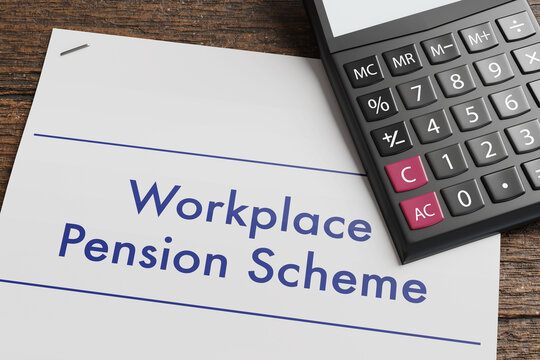 Stapled agreement of workplace pension scheme and a calculator on a wooden table. Illustration of the concept of retirement planning 