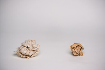 Crumpled paper isolated on white background.Paper crumpled into a ball.Paper waste from bad idea.Recycling, ecology, business concept.