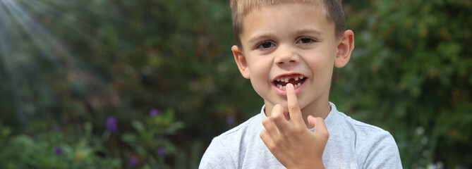 a boy without a tooth. Selective focus.