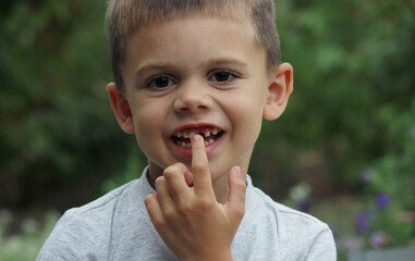 a boy without a tooth. Selective focus.