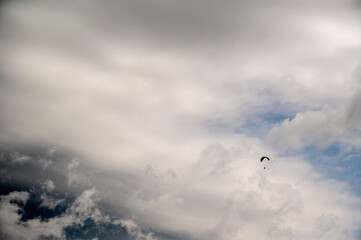 parachutist in the sky above the mountains in the valley, active recreation in the Ukrainian...