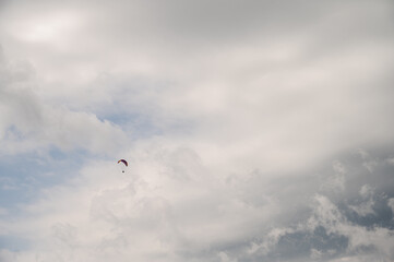 parachutist in the sky above the mountains in the valley, active recreation in the Ukrainian mountains