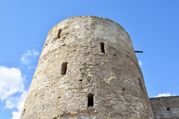 Fototapeta na wymiar Izborsk fortress. Russia. Stone tower with shooting loopholes 
