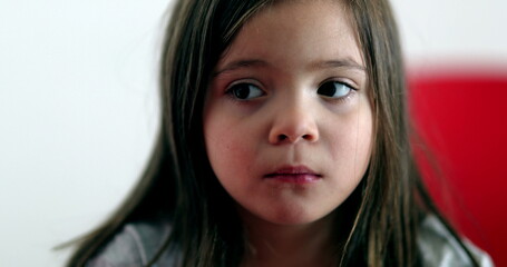 Little girl sad face emotion close-up portrait