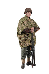 Male actor in the uniform of a German army soldier during World War II with a machine gun