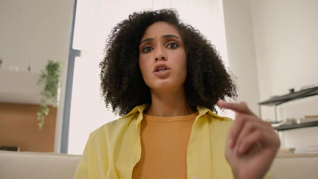 Point of view POV from computer webcam angry annoyed African American woman stressed girl talk emotional video call stress yelling anger hate speech arguing upset mad businesswoman online job issue