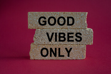 Concept word Good vibes only on brick blocks. Beautiful red background. Business motivational good vibes only concept. Copy space.