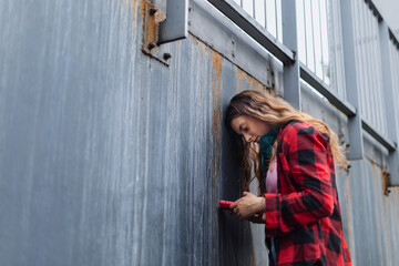 Fototapeta premium Gen Z girl outdoors in the city, feeling sad, anxious and alone. Concept of gen Z as loneliest generation.