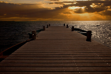 Sunset on the Horizon in Cayman Islands, Long Boardwalk to the Ocean