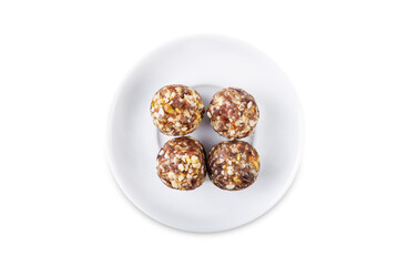 Dates and nuts raw healthy balls on a white isolated background