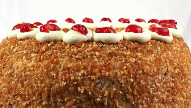 Frankfurt Kranz Torte, also known simply as Kranz in Germany, is a classic and beloved German dessert. The cake rotates on a white background.