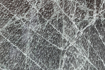Cracks on the glass. The entire image is covered with a pattern. Beautiful background