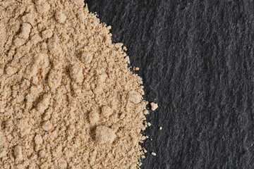 Spice ground ginger closeup on macro photography.