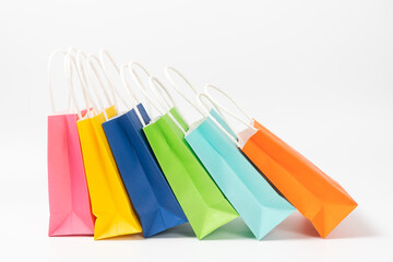 Multi colored gift or shopping bags isolated on white background