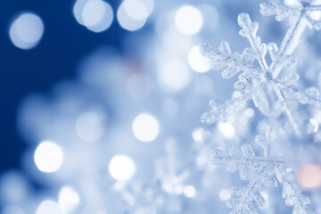 Beautiful Christmas background with bright flowers, snowflakes and bokeh effect.