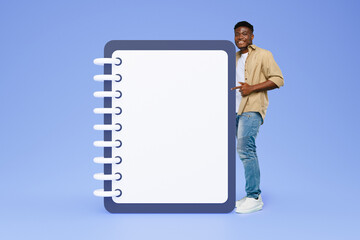 Positive millennial african american guy point finger at big plan list with free space