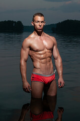 Shirtless male model in the water