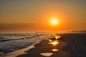 Colorful morning landscape on the Polish Baltic Sea. Sunrise on the beach in Leba, Poland. - 660144368