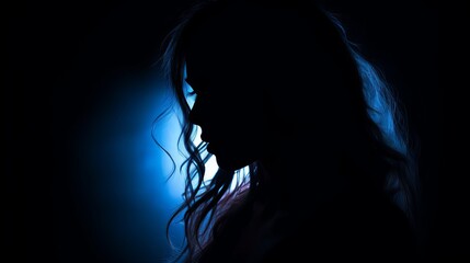 Naklejka premium Sadness concept, silhouette of unrecognizable young gorgeous female with a dark background