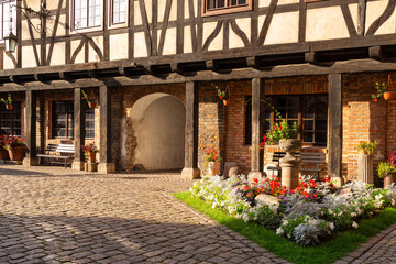Fototapeta premium Old garden and a yard of the medieval christian monastery, Poland