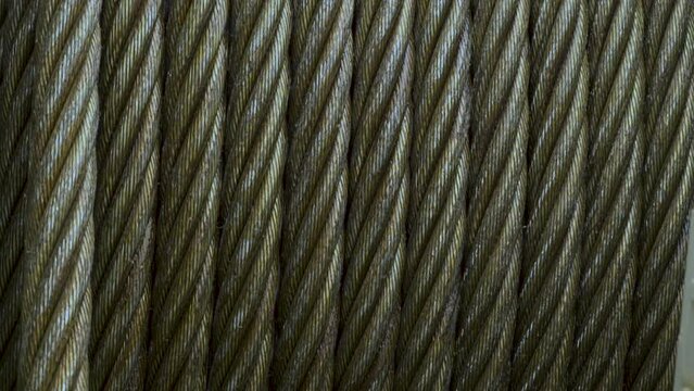 Metal winch cable. Metal rope wound on a spool.
