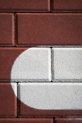 red concrete pavement with white paint